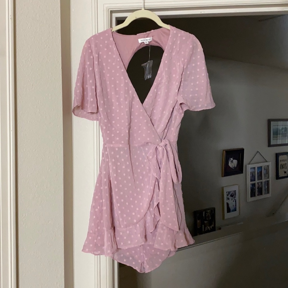 Pink Swiss dot romper with skirt overlay